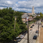 a view of south oakland with the cathedral of learning in the background